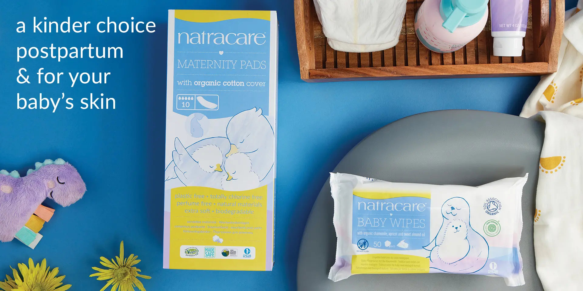 flay lay of natracare maternity pads and organic baby wipes saying a kinder choice postpartum and for baby skin